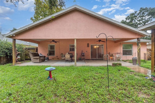 715 Unabelle Ave, Daytona Beach, FL 32117 - back of property featuring a patio, ceiling fan, and a lawn