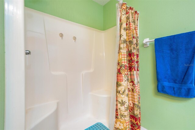 715 Unabelle Ave, Daytona Beach, FL 32117 - bathroom with a shower with shower curtain