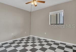 unfurnished room with ceiling fan