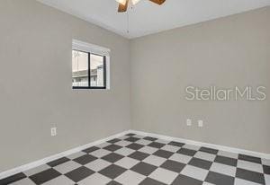 unfurnished room featuring ceiling fan