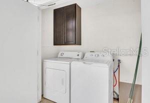 clothes washing area with independent washer and dryer