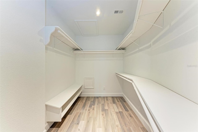 spacious closet featuring hardwood / wood-style floors