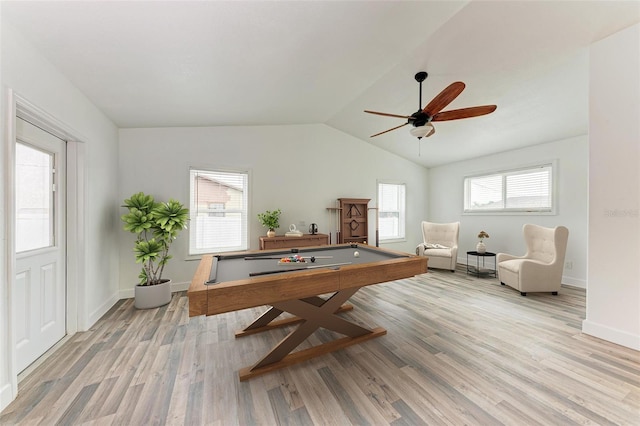 rec room featuring light wood-type flooring, lofted ceiling, ceiling fan, and plenty of natural light