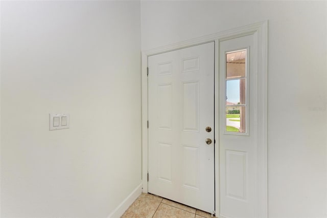 entryway with light tile patterned floors