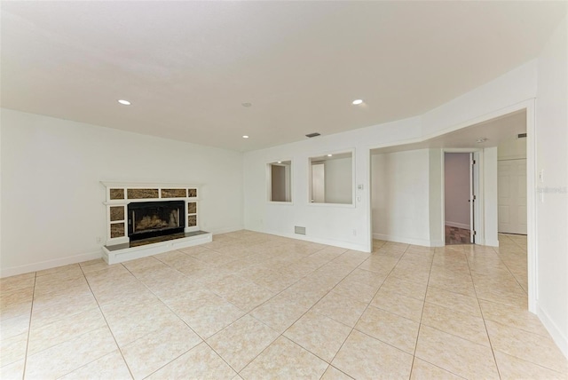 unfurnished living room featuring light tile patterned floors