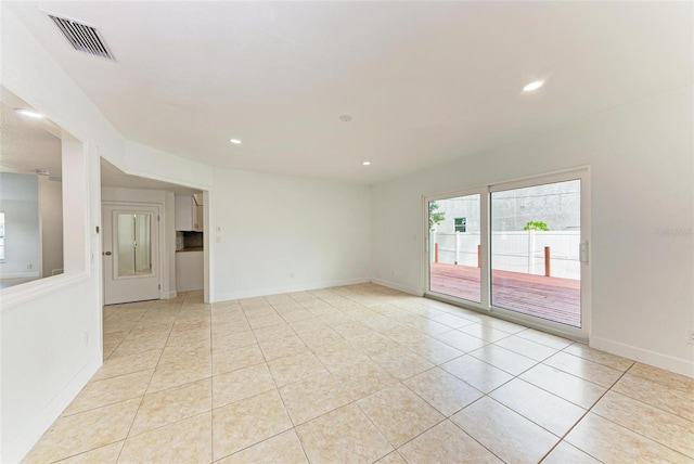 spare room featuring light tile patterned floors