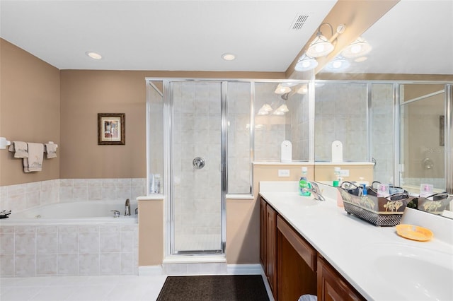 bathroom with vanity, independent shower and bath, and tile patterned floors