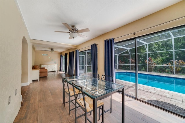 view of swimming pool with ceiling fan