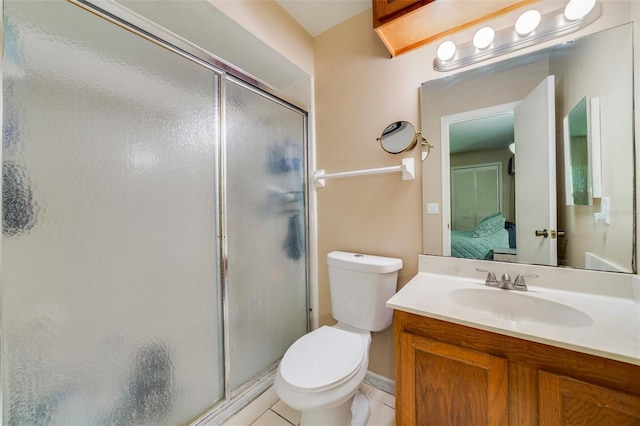 full bath with vanity, toilet, a stall shower, and ensuite bathroom