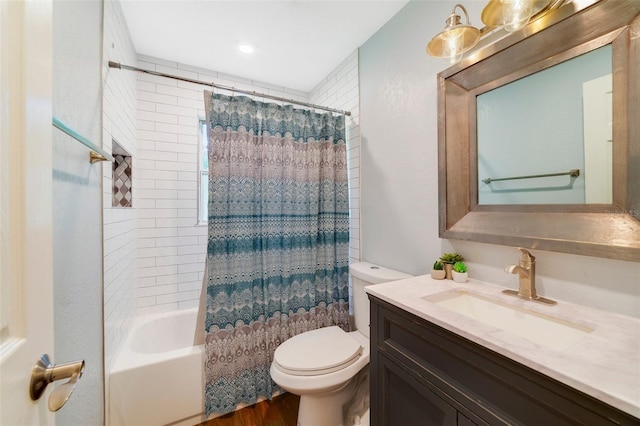 full bath featuring shower / tub combo with curtain, toilet, and vanity