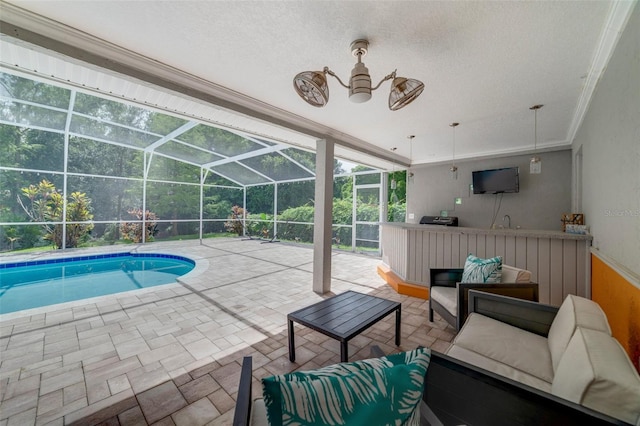 pool featuring glass enclosure, outdoor lounge area, and a patio