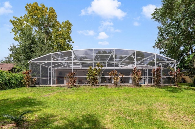 668 Coral Way, Winter Springs, FL 32708 - rear view of house featuring a yard and glass enclosure