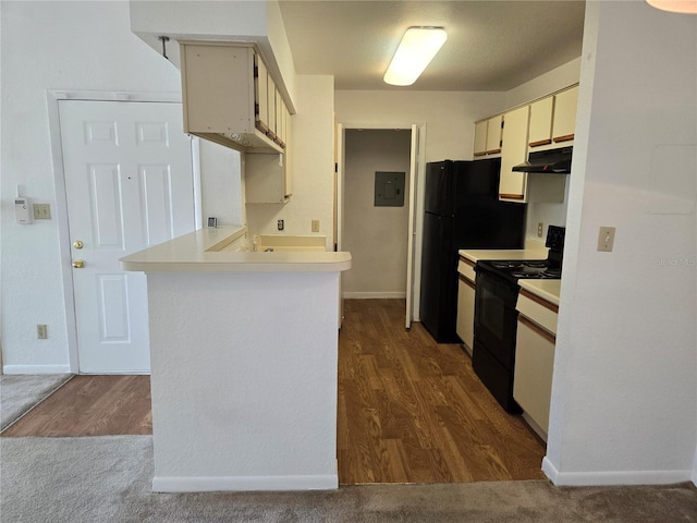 kitchen featuring dark wood-type flooring, electric range, electric panel, and kitchen peninsula