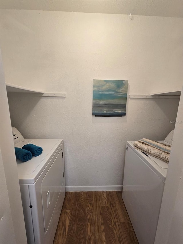 4401 Thornbriar Ln Unit 202, Orlando, FL 32822 - washroom featuring independent washer and dryer, dark wood finished floors, and baseboards