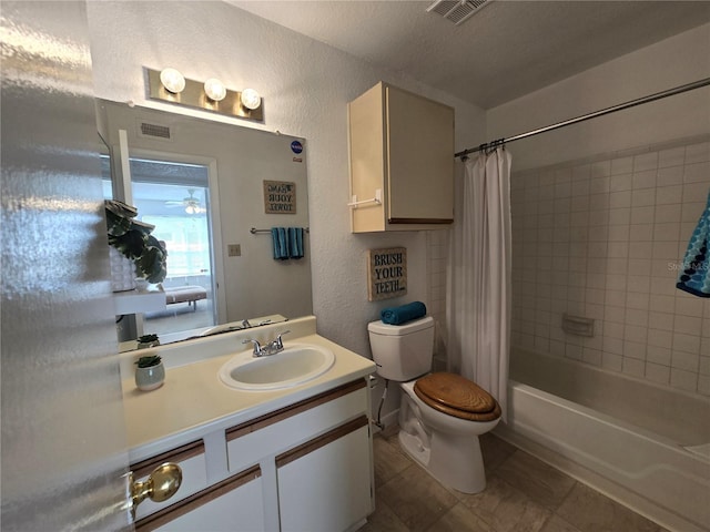 4401 Thornbriar Ln Unit 202, Orlando, FL 32822 - full bath featuring toilet, a textured wall, vanity, shower / tub combo with curtain, and tile patterned floors