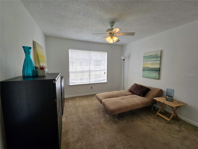 4401 Thornbriar Ln Unit 202, Orlando, FL 32822 - living area featuring a ceiling fan, carpet flooring, a textured ceiling, and baseboards
