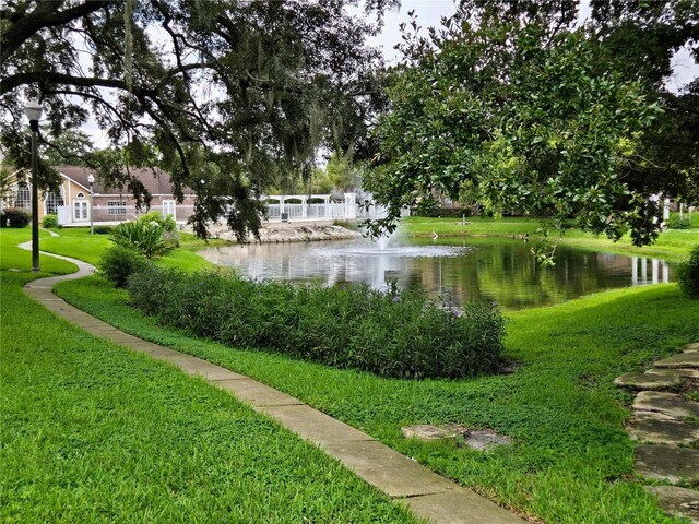 4401 Thornbriar Ln Unit 202, Orlando, FL 32822 - view of home's community with a water view and a yard