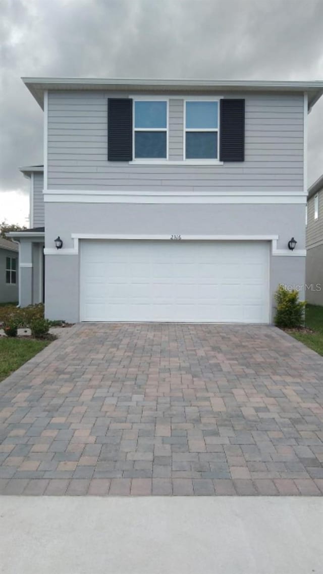 view of front of property with a garage