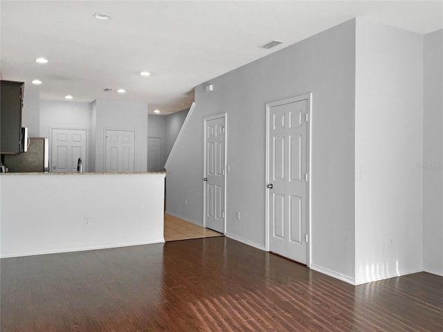 unfurnished living room featuring hardwood / wood-style floors