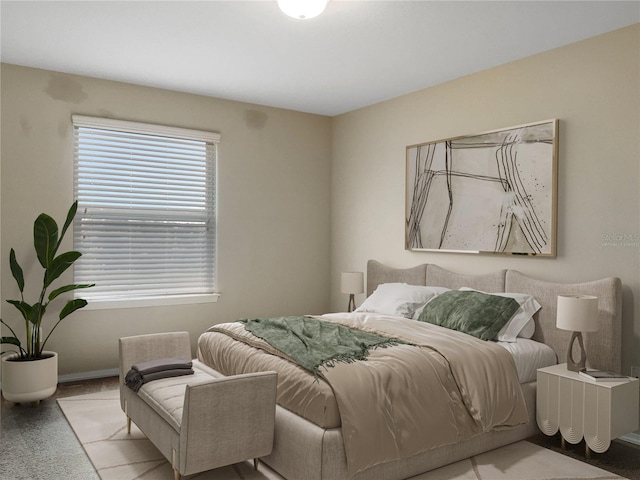 bedroom with baseboards and carpet floors