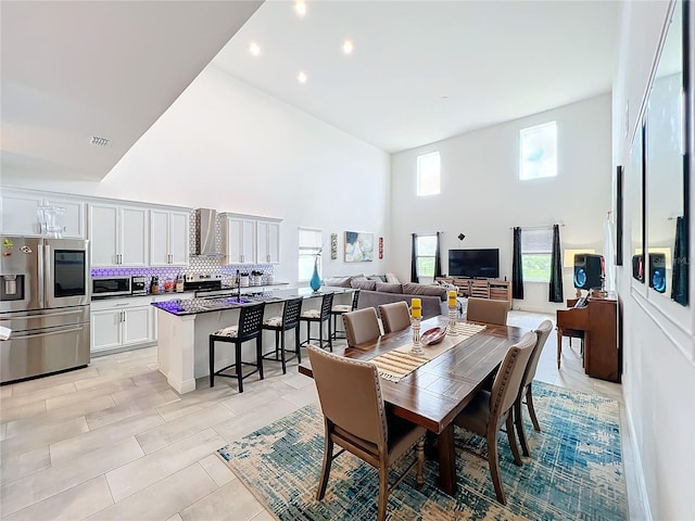 dining room featuring a high ceiling