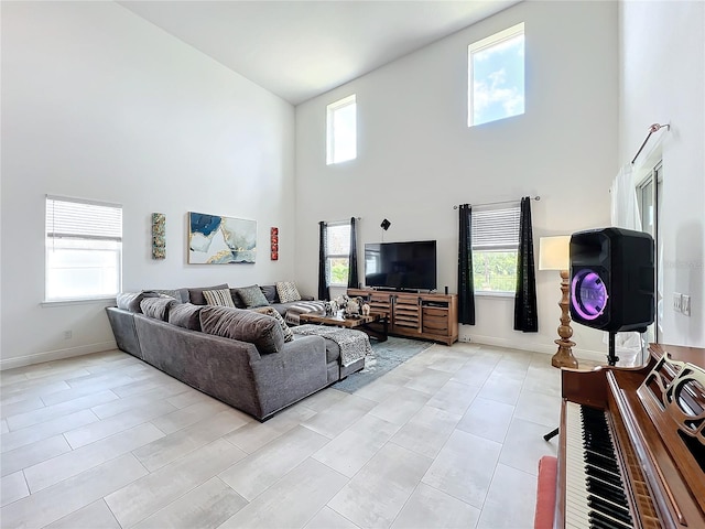 living room with high vaulted ceiling