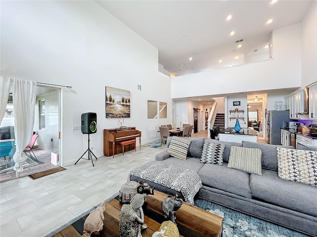 living room with a high ceiling