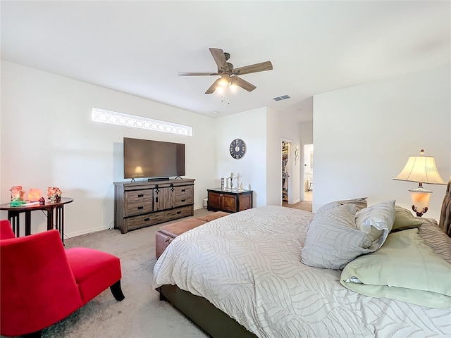 carpeted bedroom with a closet, ceiling fan, and a spacious closet