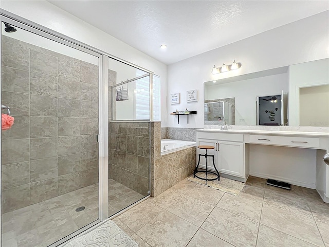 bathroom with vanity, tile patterned floors, and plus walk in shower