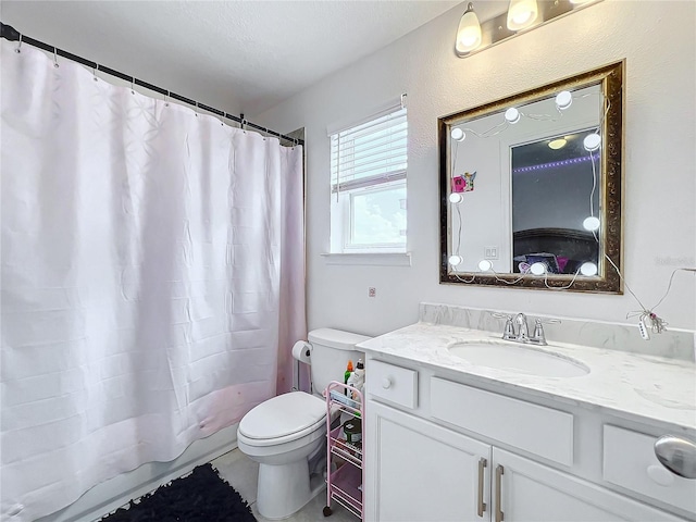 full bathroom featuring shower / bath combination with curtain, toilet, a textured ceiling, and vanity