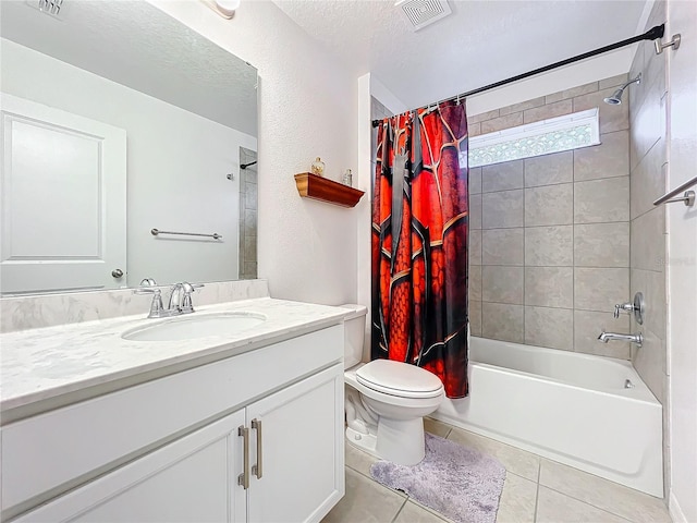 full bathroom featuring a textured ceiling, vanity, tile patterned flooring, toilet, and shower / bath combo with shower curtain