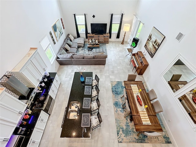 living room with a towering ceiling