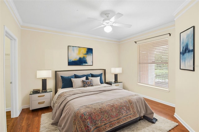 bedroom with ceiling fan, hardwood / wood-style flooring, and crown molding