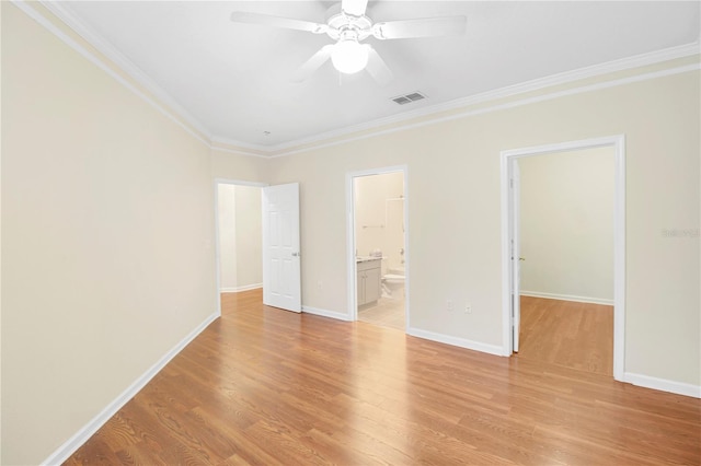 unfurnished bedroom featuring ensuite bath, ornamental molding, light hardwood / wood-style flooring, and ceiling fan