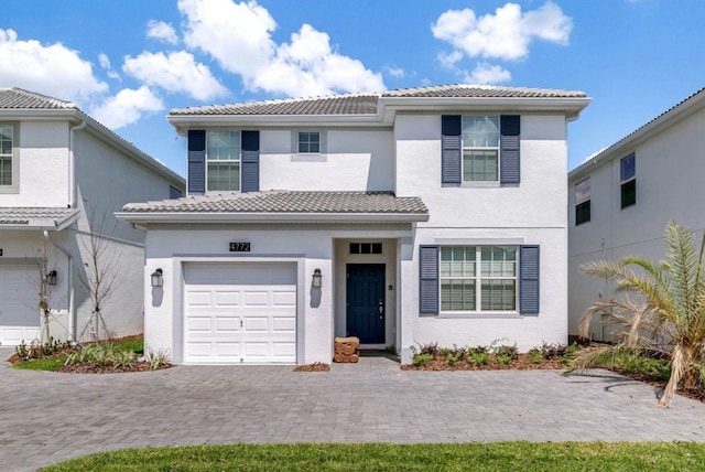 mediterranean / spanish house featuring a garage