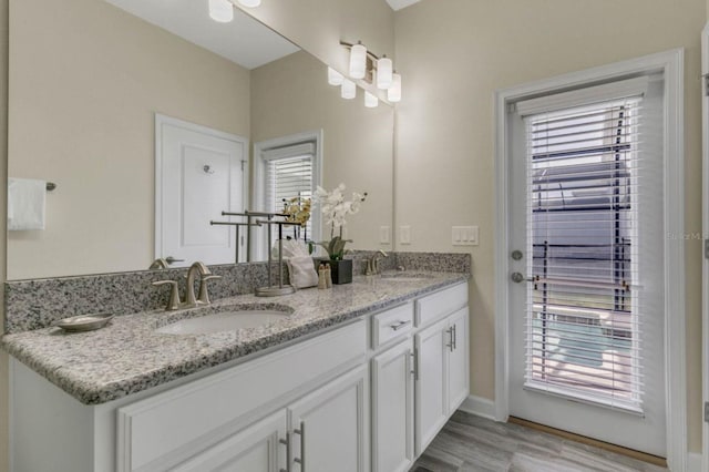 bathroom featuring wood-type flooring and vanity