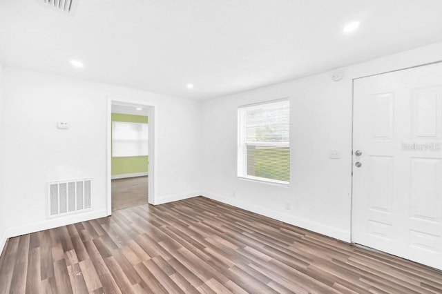 unfurnished room featuring hardwood / wood-style floors