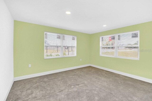 5351 E Johnson Ave, Haines City, FL 33844 - spare room with baseboards, recessed lighting, and carpet floors