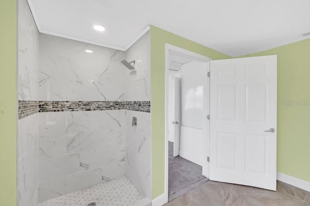 bathroom with a tile shower