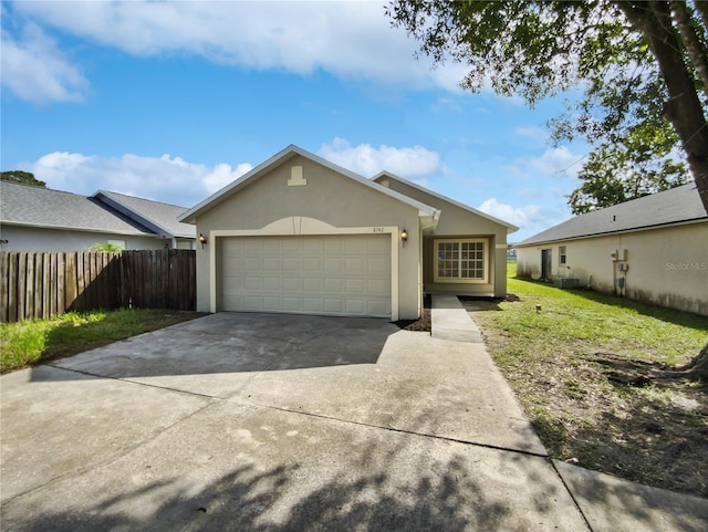 single story home with a garage and a front yard