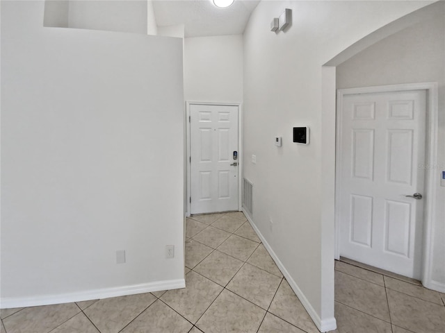 hall with light tile patterned flooring