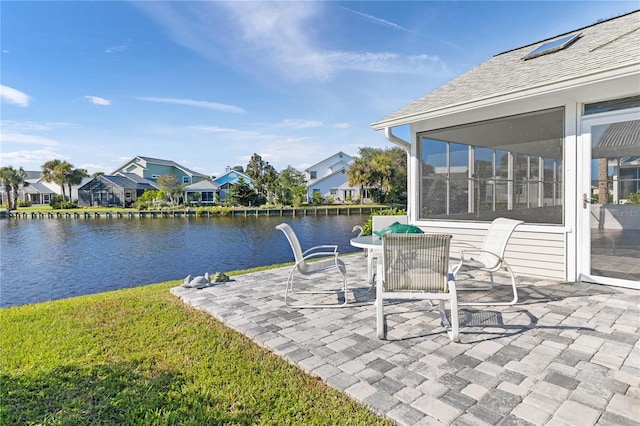 view of patio with a water view