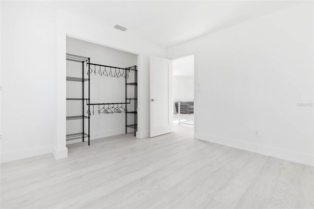 unfurnished bedroom featuring light hardwood / wood-style floors