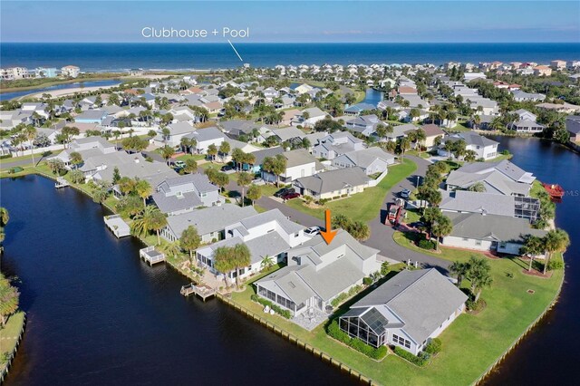 birds eye view of property featuring a water view