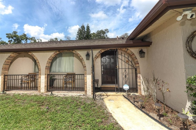 entrance to property with a yard