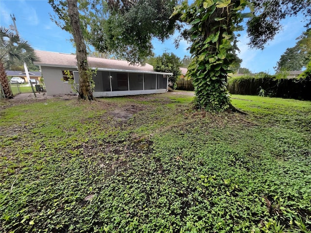 view of yard featuring a sunroom