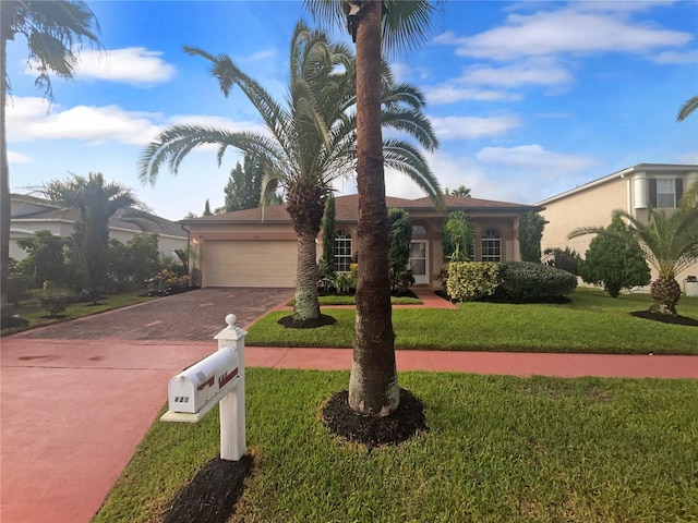 view of front facade featuring a front yard and a garage