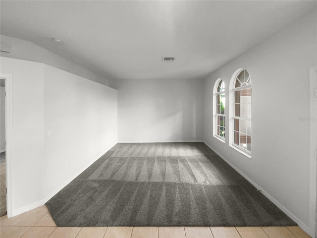 empty room featuring light tile patterned floors