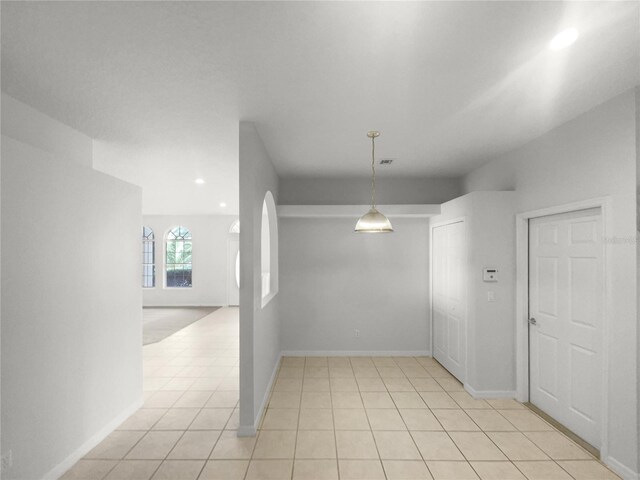 empty room with light tile patterned floors