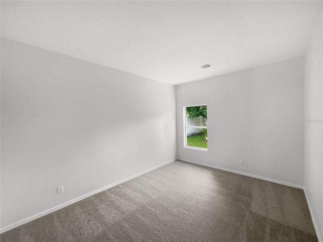 empty room featuring carpet flooring